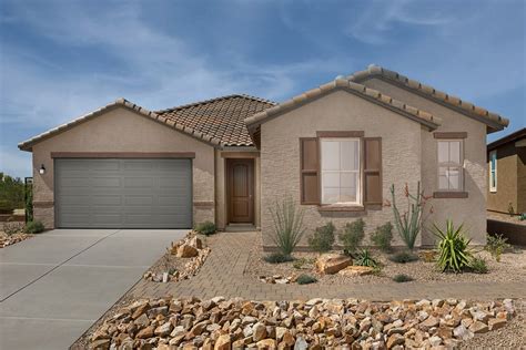 The heart of the home is a large, open great room and an upscale kitchen with a huge island and granite countertops. . Tucson housing